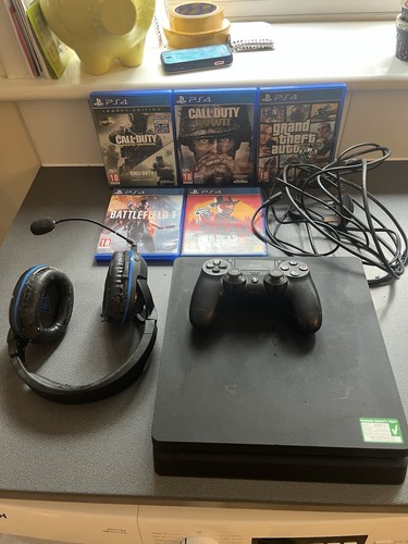 Sony playstation with games - 4,